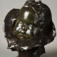 Jean-Joseph Carriès (1855-1894), "Bébé au bonnet et à la bavette", bronze à patine brun-vert nuancé, fonte Bingen, haut. 25 cm, sculptures - galerie Tourbillon, Paris